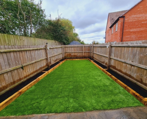 new artificial grass lawn with sleeper beds in Coalville