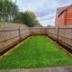 new artificial grass lawn with sleeper beds in Coalville